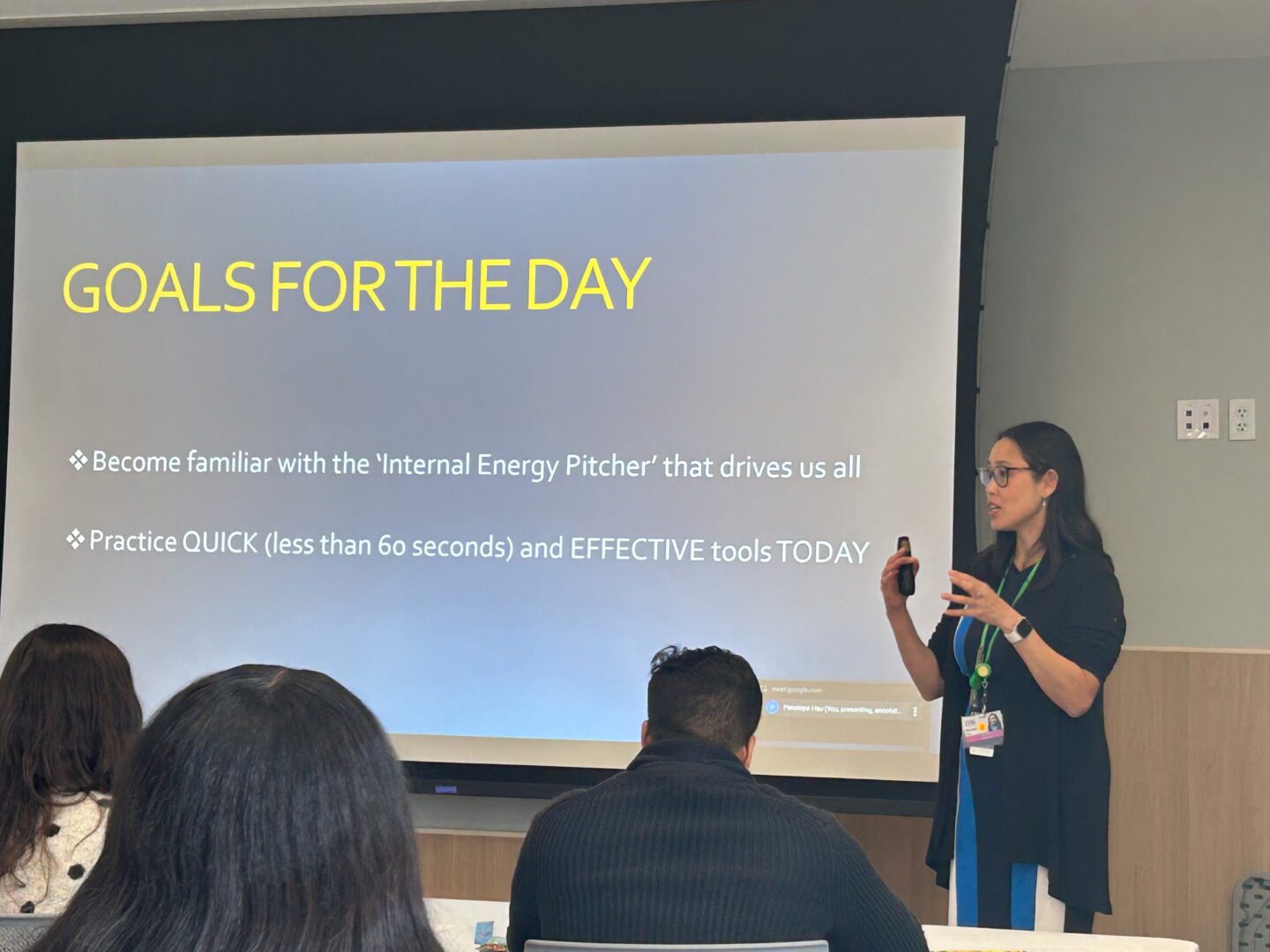 Woman presenting goals on a screen. Woman presenting goals on a screen.